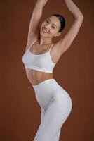 Front ,view. Beautiful ,fitness woman is in the studio photo