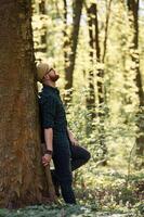 Bearded man, is ,in ,the forest at daytime photo