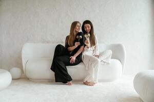 Event, with ,drinks, celebrating. Two ,,happy young female best friends are indoors photo