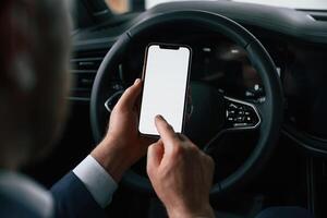 White copy space, on ,smartphone. Businessman is in the brand new car photo