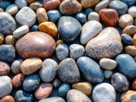 Smooth Colorful Pebbles Forming a Natural Textured Pattern photo
