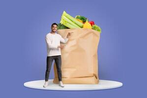A smiling customer showcases a large paper bag filled with fresh produce, highlighting the joy of grocery shopping in a modern, digital environment focused on home delivery. photo