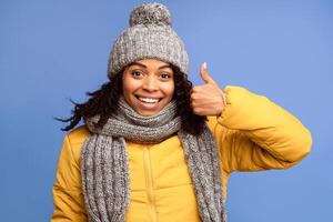 I Like It. African American Woman Gesturing Thumbs-Up Gesture Approving And Recommending Something Posing Standing Over Purple Studio Background, Smiling To Camera. Thumbs Up Concept photo