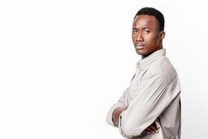 Upset black man with arms crossed posing on grey studio background, panorama with copy space for text or advertisement. Side view of disappointed african american guy after fight with his lover photo