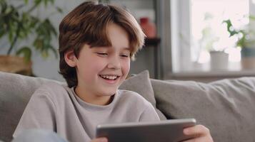 This young person enjoys a lively call using a tablet while relaxing on a couch. photo