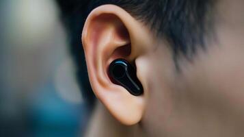 This Person is actively talking on a phone call using a wireless headset, immersed in conversation. photo