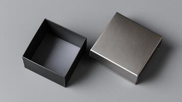 A sleek box lies open beside its matching lid, revealing the empty interior. The smooth surface underneath reflects a hint of light, creating a refined and elegant atmosphere for gift giving. photo