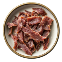 Dried meat strips neatly arranged on a plate viewed from above against a clean background, dried meat strips on plate shot from above isolated on transparent background png