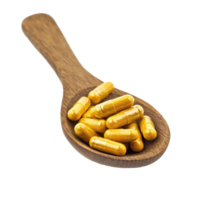 Turmeric capsules resting in a wooden spoon on a Transparent background for natural health remedies, Turmeric Capsule in wood spoon isolated on background png
