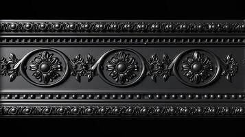 A black and white photo of a decorative metal panel