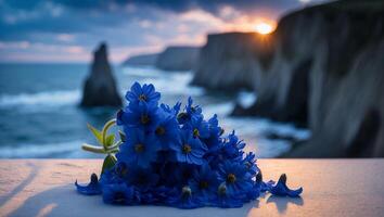 Blue Flowers at Coastal Cliffside with Sunset Sea View photo