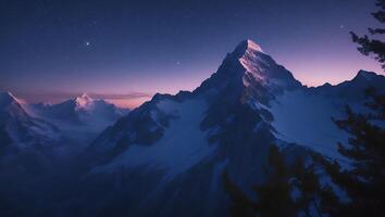 Snowy Mountain Peaks Under a Starry Night Sky at Dusk photo
