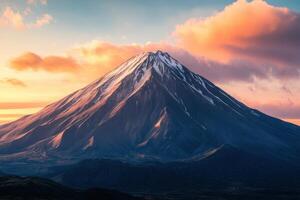 Majestic snow-capped mountain peaks under a colorful sunset sky photo