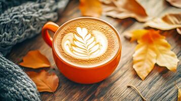 Pumpkin Spice Latte In Cozy Autumn Setup With Knitwear And Leaves photo