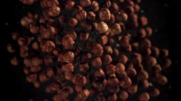 Hazelnuts fly up and fall down. Filmed on a high-speed camera at 1000 fps. High quality FullHD footage video