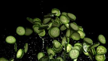 Sliced cucumbers fly up and fall down. Filmed on a high-speed camera at 1000 fps. High quality FullHD footage video