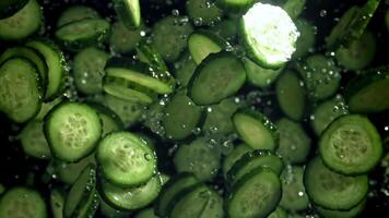Sliced cucumbers fly up and fall down. Filmed on a high-speed camera at 1000 fps. High quality FullHD footage video