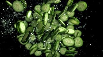Sliced cucumbers fly up and fall down. Filmed on a high-speed camera at 1000 fps. High quality FullHD footage video