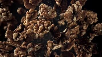 Walnuts fly up and fall down. Filmed on a high-speed camera at 1000 fps. High quality FullHD footage video