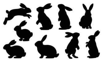 Collection of Rabbit Silhouettes in Different Poses, Including Leaping, Sitting, and Side Views vector