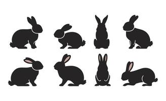 Set of Rabbit Silhouettes in Black, Displaying Multiple Stances of Sitting, Standing, and Hopping vector