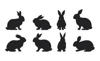 Black Silhouettes of Rabbits in Various Poses Showing Different Angles and Sitting Stances vector