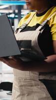 Vertical Photovoltaics factory engineer using laptop to do performance testing of solar panel production line. Technician improving sustainable solar energy configurations for cost reduction. Camera B. video