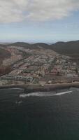 Vertical aerial Shot Approaching Palm-Mar in Tenerife from the Ocean During Daylight. video