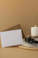 Easter mock up envelope empty card template Creative handmade Easter table decoration with egg shells instruction candle on pastel beige background copy space. Greeting card idea Easter home tradition Seasonal sustainable recycled decor photo