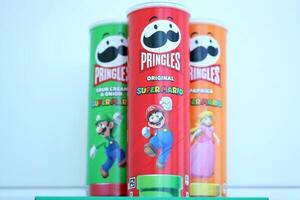 KYIV, UKRAINE - APRIL 19, 2025 Limited Edition Pringles chips tubes themed around Super Mario, featuring playful graphics photo