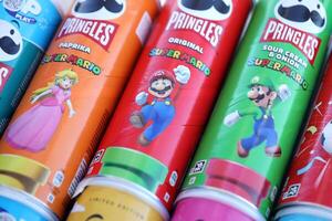 KYIV, UKRAINE - APRIL 19, 2025 Limited Edition Pringles tubes themed around Super Mario, featuring playful graphics and branding photo