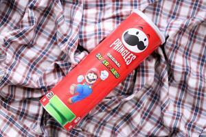 KYIV, UKRAINE - APRIL 19, 2025 Limited Edition Pringles chips tube themed around Super Mario, featuring playful branding photo