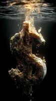 Dollar sign submerged in water with bubbles rising around it. Gold prices plunge. photo