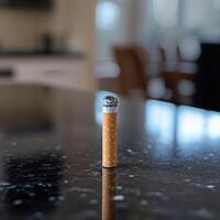 Final Cigarette on a Glossy Countertop photo