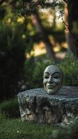 Garden Scene with Funny Mask in Sunlight photo