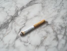 Single Cigarette Residue on Marble photo