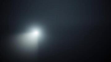 a soft, diffused beam of light gently illuminates the darkness, creating an ethereal and mysterious atmosphere photo