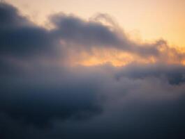 Golden hour cloudscape above the clouds. A breathtaking view of a dramatic sky at sunset, showcasing the beauty of nature's colors. photo