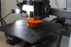 3d printer printing an object on the tray with pla filament, corn starch, non-waterproof filament, tech photo