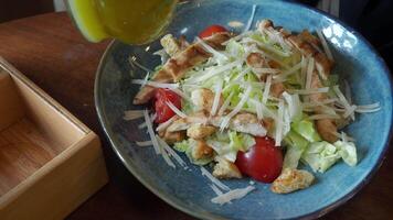 Fresh salad preparation with dressing at a local eatery video