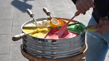 Hand Preparing Turkish Maras Dondurma with Colorful Display on a Serving Tray video