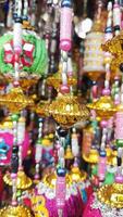 many colorful decorations hanging from a string photo
