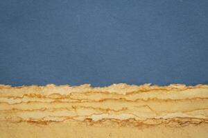 abstract desert landscape created with sheets of textured handmade paper photo