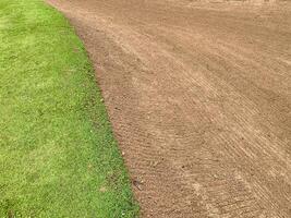 Golf Course Sand Pit Bunkers,green grass surrounding the beautiful sand holes is one of the most challenging obstacles for golfers and adds to the beauty of the golf course photo