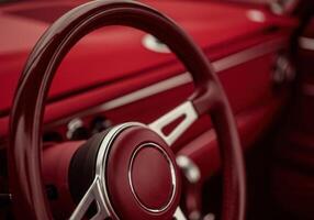 Futuristic dark red cherry car interior design highlighting steering wheel photo