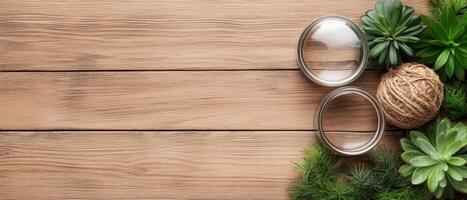 Wooden planks surface background with green plants glass jars and a twine ball on corner flat lay backdrop photo