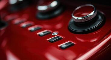 Close-up of high-tech vehicle dashboard controls in vivid red finish photo