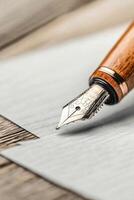 Elegant Wooden Pen Point Above Paper. Business Concept. Owner Writing Important Notes. Close View on Desk. Vintage Style. Work Process photo