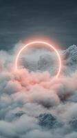 Glowing circle light hovers over misty mountain peaks and drifts of clouds in twilight colors over a dark sky photo