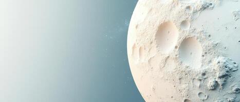 White planet surface detail showing craters against pale blue space. Round moon with rough texture and craters. Small distant stars are visible. photo